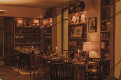 a dining room with a long table and chairs at HOTEL AMOUR NICE in Nice