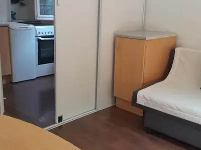 a small room with a door to a kitchen at Les Palmiers NiceAirport, Beach200m, 2bedrooms, Wifi Optic in Nice