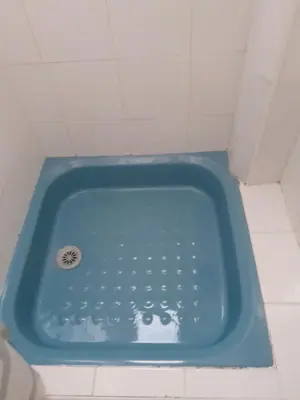 a blue bath tub in a white tiled bathroom at Les Palmiers NiceAirport, Beach200m, 2bedrooms, Wifi Optic in Nice