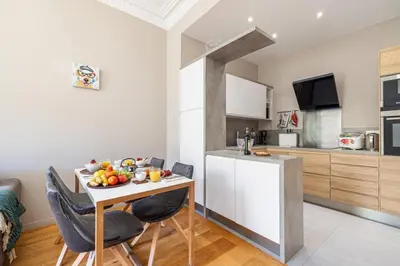 a kitchen with a small table with fruit on it at MY CASA - JOFFRE 49-D - Charming 2 bedroom - Carré d'Or in Nice