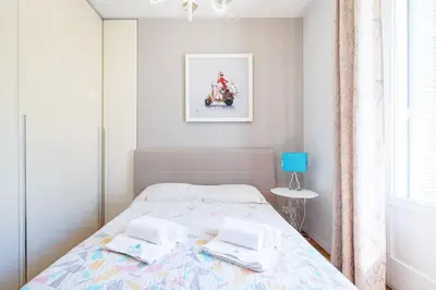 a bedroom with a bed with two towels on it at MY CASA - JOFFRE 49-D - Charming 2 bedroom - Carré d'Or in Nice