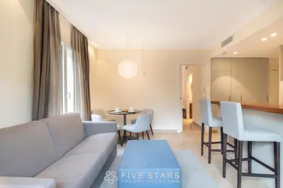 a living room with a couch and a table at Villa Artemys - Five Stars Holiday House in Saint-Jean-Cap-Ferrat