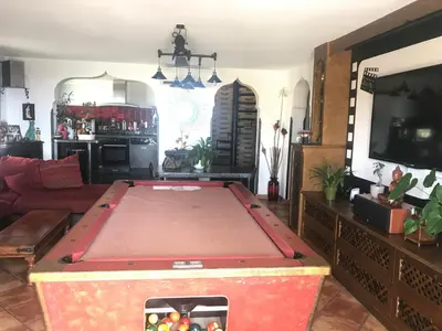 a living room with a pool table in it at Chambres chez l'habitant Villa l'Île aux Anges in Saint-Andre-de-la-Roche