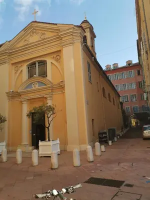 a yellow church with a tree in front of it at Appartement Vieux-Nice N in Nice