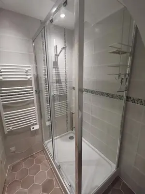 a shower with a glass door in a bathroom at Appartement Vieux Nice S in Nice