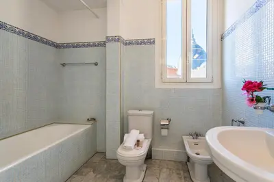 a bathroom with a tub and a toilet and a sink at Ambassador Palace AP2095 by Riviera Holiday Homes in Nice
