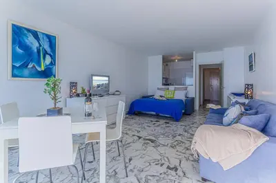 a living room with a couch and a bed at MY CASA - PROM 199 - Spacious studio - Promenade - Sea View in Nice