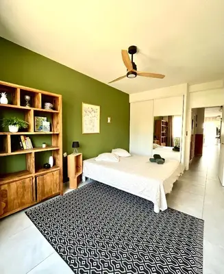 a bedroom with a bed and a ceiling fan at 2 Bedrooms - Sea View Apartment in Nice