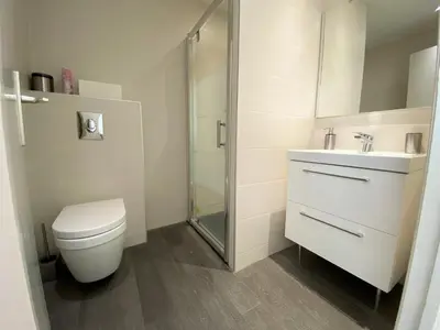 a bathroom with a toilet and a sink and a shower at SEA FRONT - panoramic sea view studio with terrace in Nice