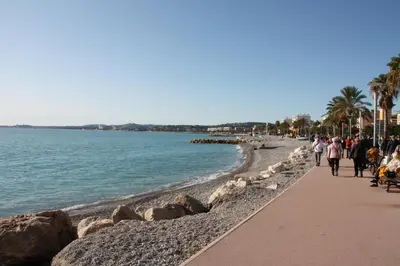 a statue of a man dancing on the beach at Studio F1 vue mer a 30m des plages in Cagnes-sur-Mer