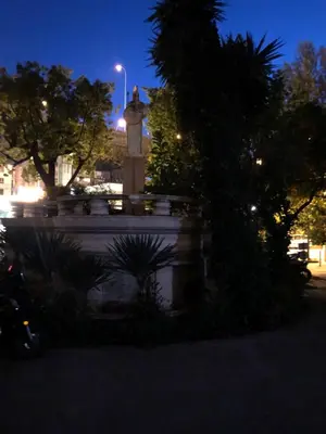 a statue in the middle of a park at night at Le Palladium quartier Tzaréwitch Nice in Nice