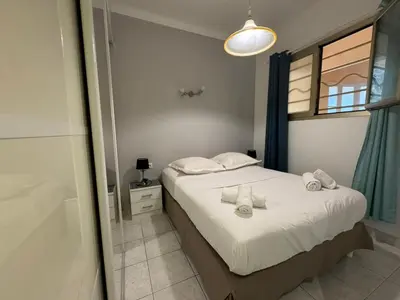 a bedroom with a bed with towels on it at NEREIDES - Appartement 4 personnes avec Vue Mer exceptionnelle à Villefranche-sur-Mer in Villefranche-sur-Mer