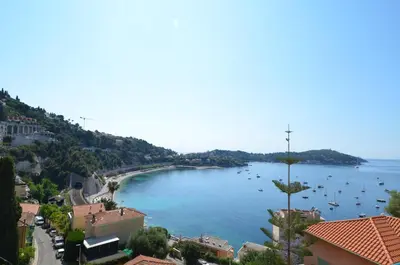 a view of a large body of water with boats in it at NEREIDES - Appartement 4 personnes avec Vue Mer exceptionnelle à Villefranche-sur-Mer in Villefranche-sur-Mer
