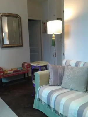 a living room with a couch and a table at Nizza - Boutique Wohnung - near Hotel Negresco in Nice