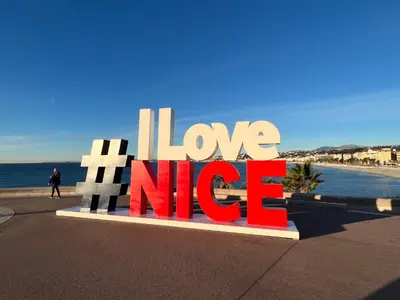 a sign that says i love nicole next to a beach at PALAIS ELISABETH PROMENADE DES ANGLAIS in Nice