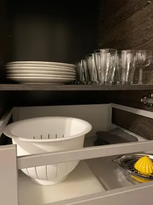 a kitchen with a white bowl and plates on a shelf at PALAIS ELISABETH PROMENADE DES ANGLAIS in Nice