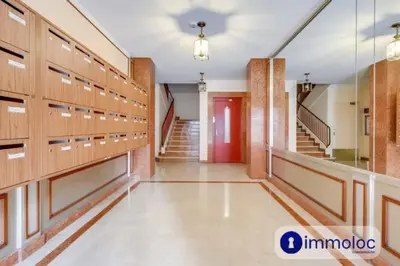 a hallway of a gym with wooden lockers at Air-conditioned apartment in the Libération district in Nice
