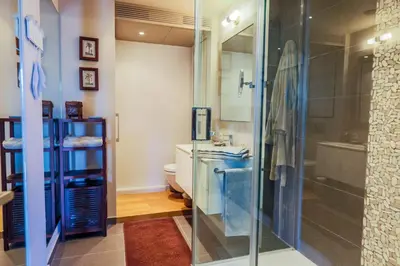 a bathroom with a glass shower and a sink at Vue Magenta AP4188 by Riviera Holiday Homes in Nice