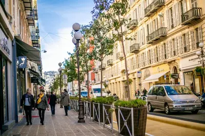 people walking down a city street with buildings at Vue Magenta AP4188 by Riviera Holiday Homes in Nice