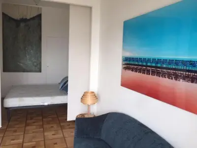 a room with a bed and a painting on the wall at 91 Promenade des Anglais le stellamar in Nice