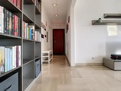 a hallway with book shelves filled with books at Nestor&Jeeves - SUNSET TERRACE - Central - Free parking - Top floor in Nice