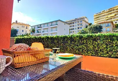 a glass table with a basket of food on a balcony at Nestor&Jeeves - SUNSET TERRACE - Central - Free parking - Top floor in Nice