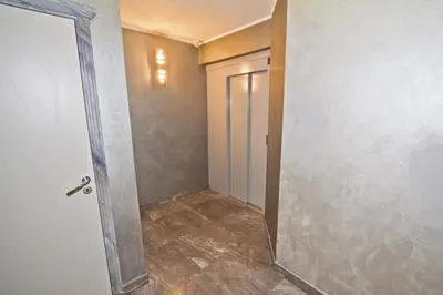 an empty hallway with a door in a room at PROMENADE HOLIDAY - GRIMALDI CITY CENTER in Nice