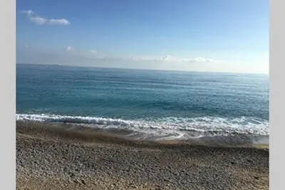 a view of the ocean from a beach at Appartement NICE proche MER et CENTRE in Nice