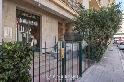 a gate in front of a building with plants at Suite Versailles Five Stars Holiday House in Nice