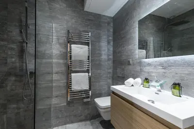 a bathroom with a sink and a toilet and a mirror at Brand New 1 Bdr Place du Pin in Nice