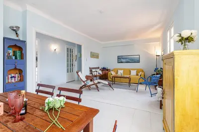 a living room with a table and a couch at Extraordinary View on Port and Castle Hill - 1 Bdr & Parking in Nice