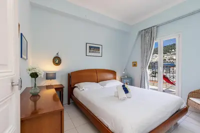a bedroom with a large bed and a window at Extraordinary View on Port and Castle Hill - 1 Bdr & Parking in Nice
