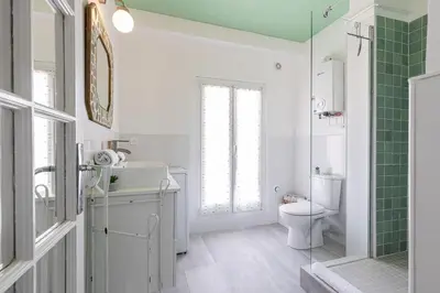 a bathroom with a toilet and a sink and a shower at Extraordinary View on Port and Castle Hill - 1 Bdr & Parking in Nice