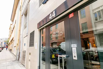 a store front with a glass door on a street at PALAIS OTHELLO in Nice