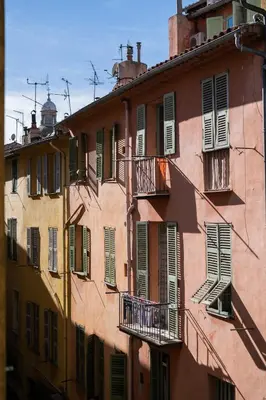 an old pink building with windows and balconies at Papa Riviera - Nice old town - 1-3 pers in Nice