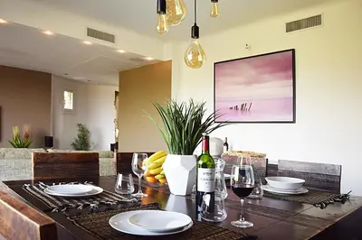 a dining room table with glasses of wine and plates at Villa Angel in La Gaude