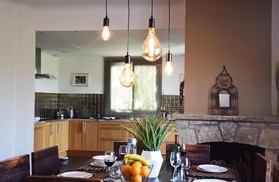 a kitchen with a table with fruit on it at Villa Angel in La Gaude