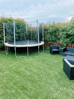 a trampoline in a yard with two chairs at Villa Angel in La Gaude