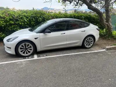 a white car parked in a parking lot at Studio Jardin Fleuris Parking in Nice
