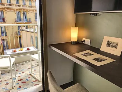 a room with a counter with a table and a window at Nestor&Jeeves - BERLIOZ SUITE - Downtown - Close beaches in Nice