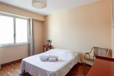a bedroom with a bed with two towels on it at Le Refuge Acajou - Welkeys in Nice