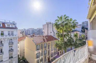 a view of a city with palm trees and buildings at MY CASA - FLEURS 22 - City Center - Modern w Terrace in Nice
