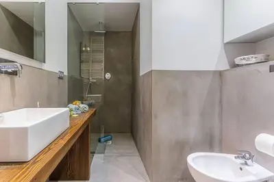 a bathroom with a sink and a tub and a mirror at MY CASA - FLEURS 22 - City Center - Modern w Terrace in Nice