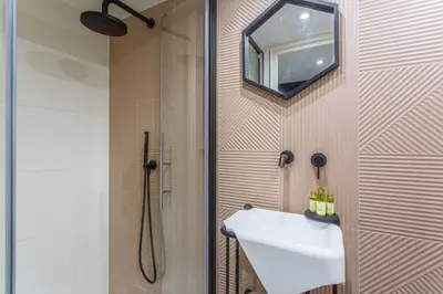 a bathroom with a sink and a shower at MY CASA - BUNICO 1 - Old Town Renovated Studio in Nice