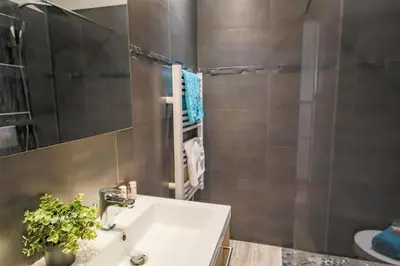 a bathroom with a sink and a mirror at MASSENET PIETONNE AP4196 by Riviera Holiday Homes in Nice