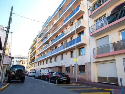a street with cars parked in front of a building at Apartment L'Amiral-1 by Interhome in Cagnes-sur-Mer