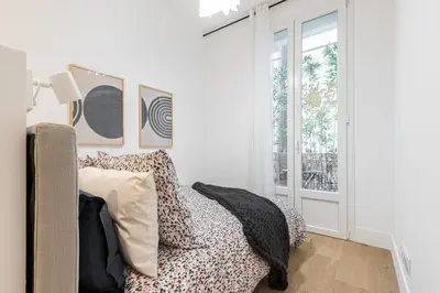 a living room with a couch and a window at HEROLD Balcon in Nice