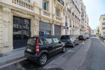 a small car parked on the side of a city street at HEROLD Balcon in Nice