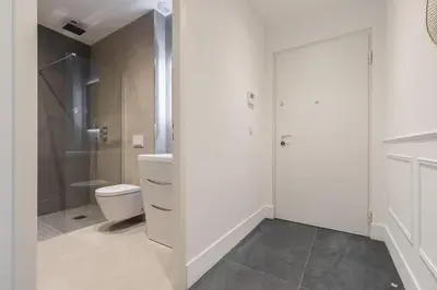 a white bathroom with a toilet and a shower at HEROLD Balcon in Nice