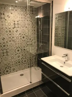 a bathroom with a white sink and a mirror at LE CLIO CARRÉ D'OR BEACH APARTMENT in Nice